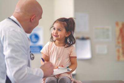 Pediatrician with Child in a Doctors Office
